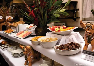 a buffet with bowls of food on a table at Hotel Encantada Casa Boutique Spa in Cusco