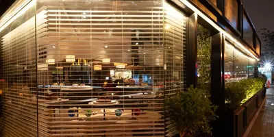 a display window of a store with surfboards in it at Roosevelt Hotel & Suites in Lima