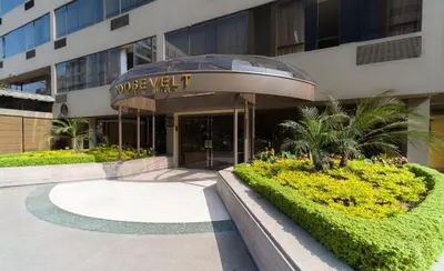 a building with a sign in front of it at Roosevelt Hotel & Suites in Lima