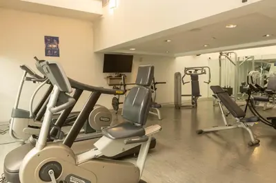 a gym with several cardio machines in a room at Casa Andina Premium Miraflores in Lima