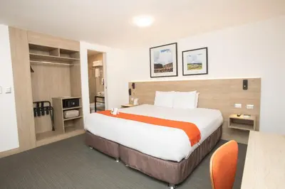 a bedroom with a large bed in a hotel room at Casa Andina Standard Cusco Plaza in Cusco