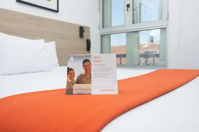 a picture of a man and a woman on a bed at Casa Andina Standard Cusco Plaza in Cusco