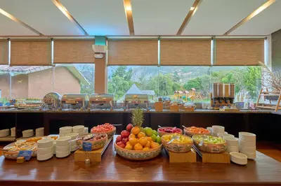 a buffet of fruits and vegetables in baskets on a table at Casa Andina Premium Valle Sagrado Hotel & Villas in Urubamba