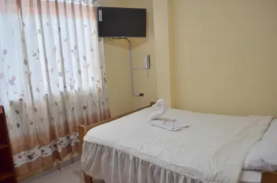 a hospital room with a bed with a swan on it at Rosenverg B&B Tours in Lima