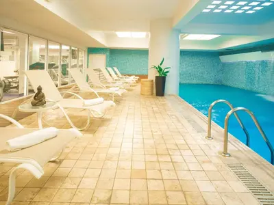 a waiting room with chairs and a swimming pool at Novotel Lima San Isidro in Lima