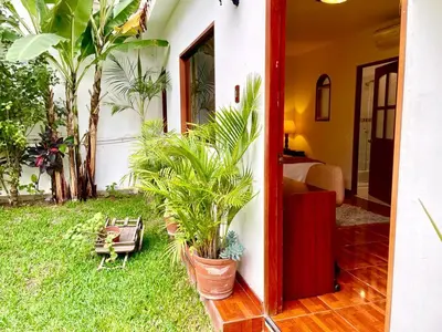 a room with plants and a room with a bedroom at Casa Bella Boutique Hotel San Isidro in Lima