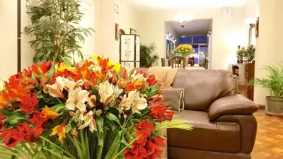 a bouquet of flowers on a couch in a store at Casa Bella Boutique Hotel San Isidro in Lima