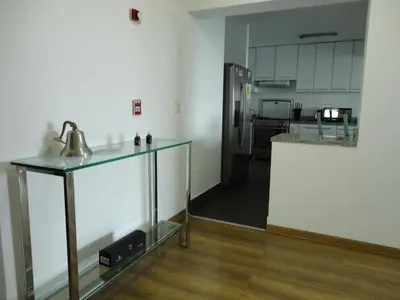 a kitchen with a counter and a counter top in a room at San Borja, bello apartamento in Lima