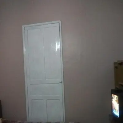 a white door in the corner of a room at Habitaciones para Estudiantes Y/o Mochileros in Lima