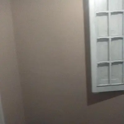 a mirror on a wall next to a window at Habitaciones para Estudiantes Y/o Mochileros in Lima