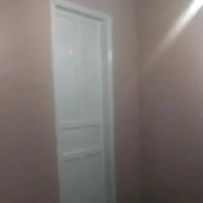 a white door in the corner of a room at Habitaciones para Estudiantes Y/o Mochileros in Lima