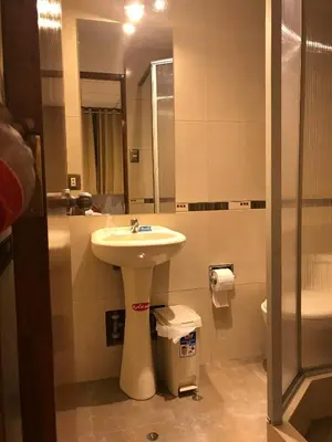 a bathroom with a sink and a mirror at Edmoli Casa Hospedaje in Cusco