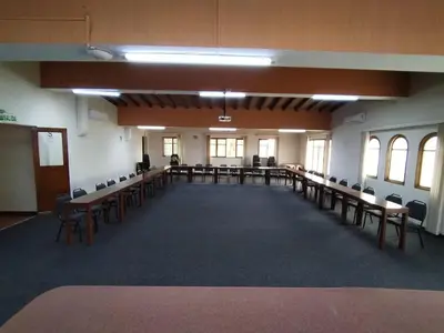 a large room with tables and chairs in it at Hotel San Isidro Inn in Lima