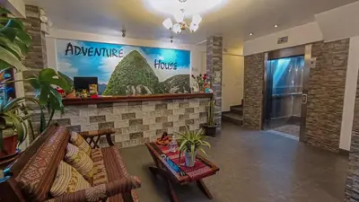 a lobby of a hotel with a waiting room at Hotel Machupicchu Adventure in Machu Picchu