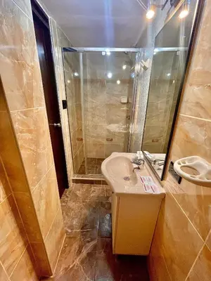 a bathroom with a sink and a shower at Mama's House in Cusco