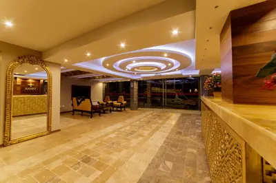 a lobby with a large mirror and a large ceiling at Yawar Inka Hotel in Cusco