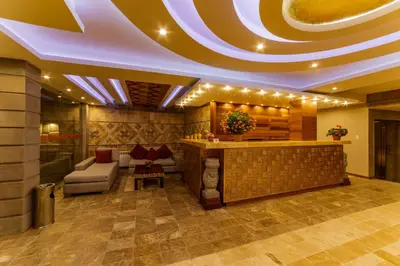 a hotel lobby with a bar and a couch at Yawar Inka Hotel in Cusco