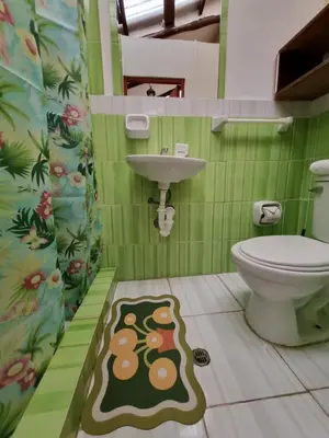 a bathroom with a toilet and a sink at La Casa de Laura - Plaza in Cusco
