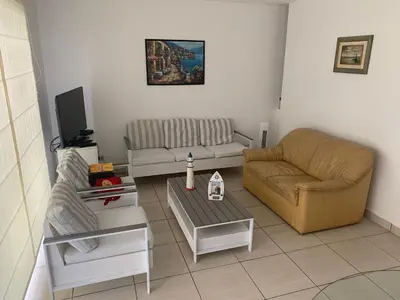 a living room with two couches and a coffee table at La Casa del Jota in Asia
