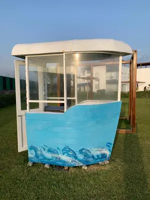 a blue and white object sitting in the grass at La Casa del Jota in Asia
