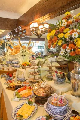 a buffet line with food on a long table at Antara Hotel & Suites - Miraflores in Lima