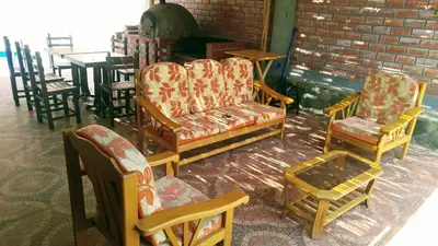 a group of chairs and tables in a room at Casa de Campo Belén - Lunahuaná in Lunahuaná