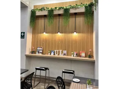a restaurant with chairs and a table and lights at Best Western Plus Urban Larco Hotel in Lima