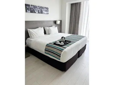 a hotel room with a bed with a tray on it at Best Western Plus Urban Larco Hotel in Lima