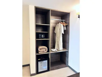 a walk in closet with a door open at Best Western Plus Urban Larco Hotel in Lima