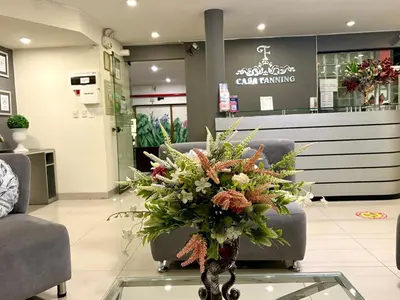 a bouquet of flowers on a glass table in a store at Casa Fanning Hotel in Lima
