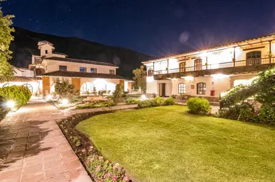 a large house with a yard at night at Sonesta Posadas del Inca - Valle Sagrado Yucay Urubamba in Urubamba