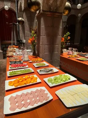 a table with many different types of food on it at Waman Qorikancha in Cusco