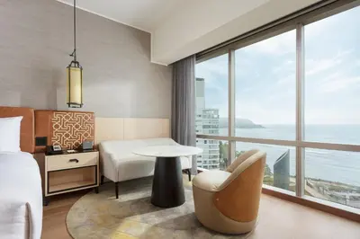 a hotel room with a bed and a table and a window at JW Marriott Hotel Lima in Lima