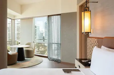 a hotel room with a bed and a large window at JW Marriott Hotel Lima in Lima