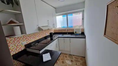 a small kitchen with a sink and a window at MALECÓN BALTA 758 - Miraflores in Lima