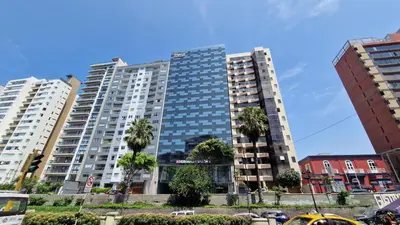 a tall building with palm trees in front of it at MALECÓN BALTA 758 - Miraflores in Lima