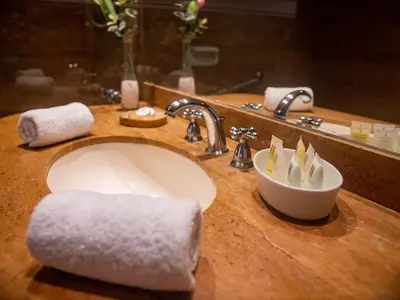 a bathroom sink with a white towel on it at San Agustin Exclusive in Lima