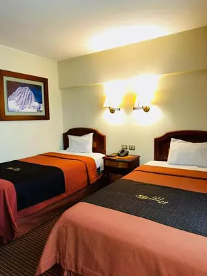 a hotel room with two beds in a room at Hotel Continental Lima in Lima