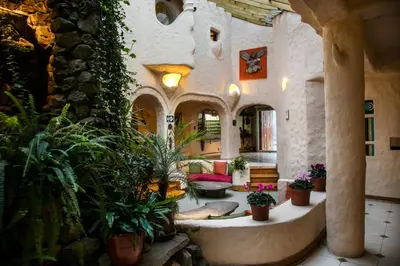 a courtyard with potted plants in a building at San Agustin Internacional in Cusco