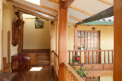 a hallway of a house with wooden beams at Amaru Inca in Cusco