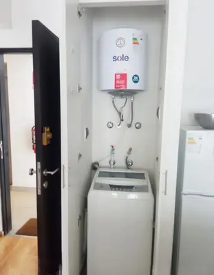 a laundry room with a washing machine and a dryer at Apartamento dúplex exclusivo y céntrico in Lima