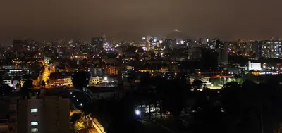 a view of a city at night with lights at Apartamento dúplex exclusivo y céntrico in Lima