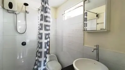 a bathroom with a sink and a shower at In the heart of Lima in Lima