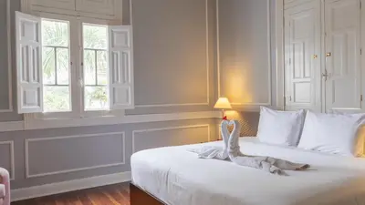 a bedroom with a bed with a dinosaur on it at Casa Republica Barranco Boutique Hotel in Lima