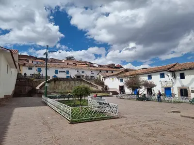 a group of white buildings in a town at Departamentos Cusco in Cusco