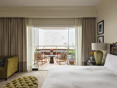 a hotel room with a bed and a balcony at Miraflores Park, A Belmond Hotel, Lima in Lima