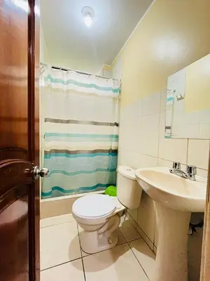 a bathroom with a toilet and a sink at Sandel in Barranca