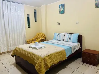 a bedroom with a bed with a tray on it at Sandel in Barranca