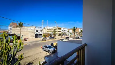 a balcony with a car on a city street at Hotel Riviera Inka Paracas in Paracas