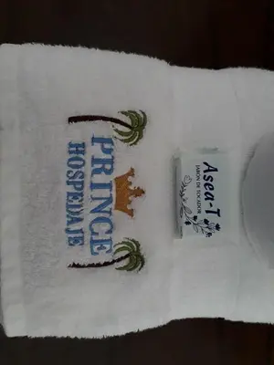 a towel with a toothbrush and a tube of toothpaste at Prince Hospedaje in Ayacucho